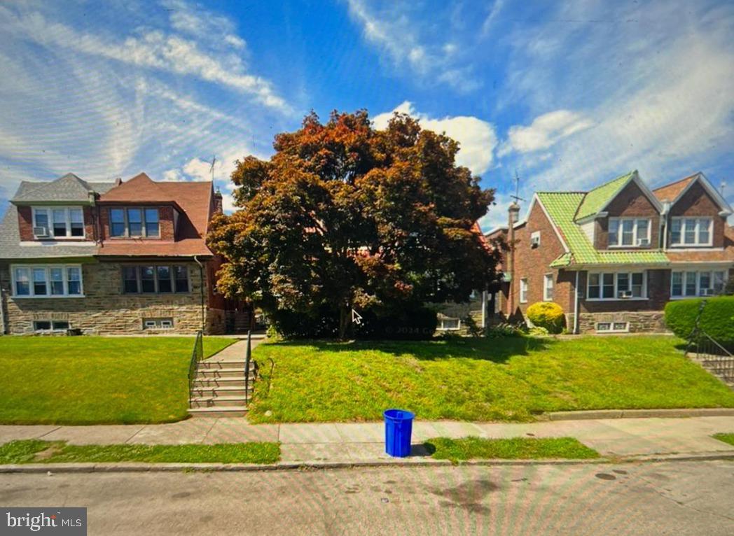 1933 71st Avenue Philadelphia, PA 19138 - Photo 1 of 6 a front view of a house with a yard and garage