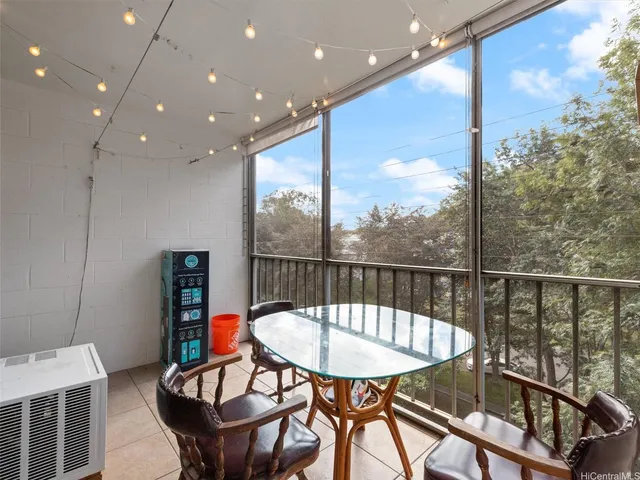 a view of a city from a dining room with furniture window and outside view