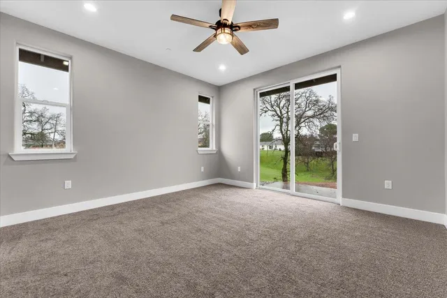 a bathroom with a sink a toilet a mirror and shower
