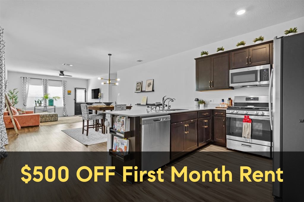 a kitchen with kitchen island granite countertop a stove and cabinets