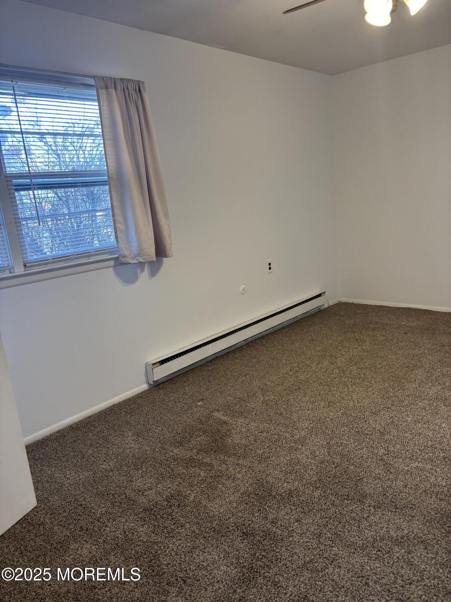 25 Robinson Road Brick, NJ 08724 - Photo 11 of 17 an empty room with a window