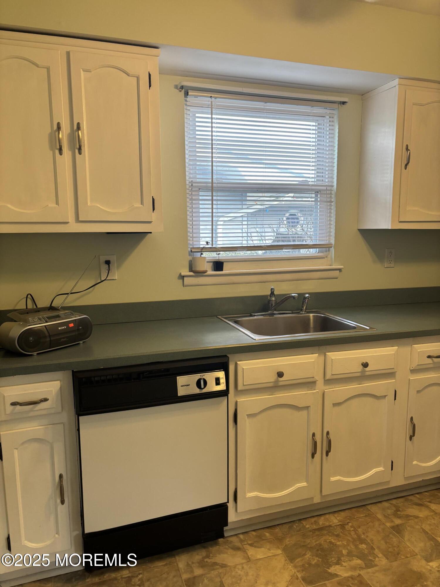 25 Robinson Road Brick, NJ 08724 - Photo 2 of 17 a view of a kitchen that has a sink and a stove