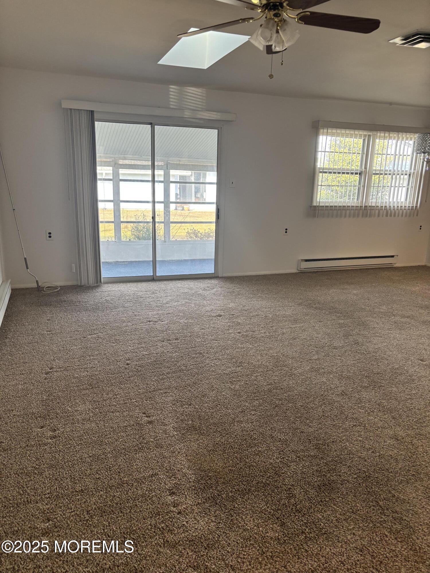 25 Robinson Road Brick, NJ 08724 - Photo 6 of 17 an empty room with a empty space and windows