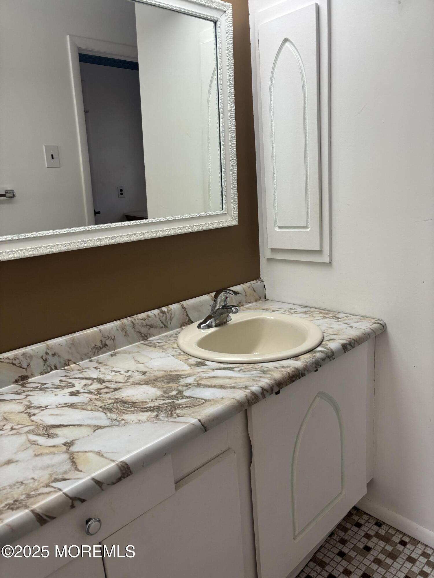 25 Robinson Road Brick, NJ 08724 - Photo 7 of 17 a bathroom with a sink and a mirror