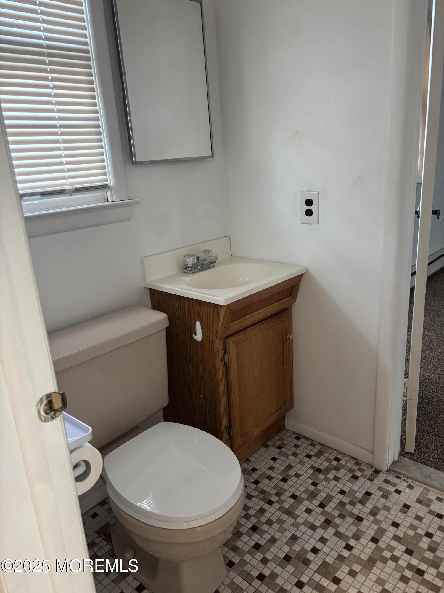 25 Robinson Road Brick, NJ 08724 - Photo 9 of 17 a bathroom with a sink and a toilet