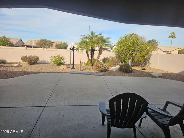 a view of a chairs and table in a patio
