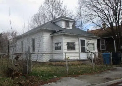 a front view of a house with yard
