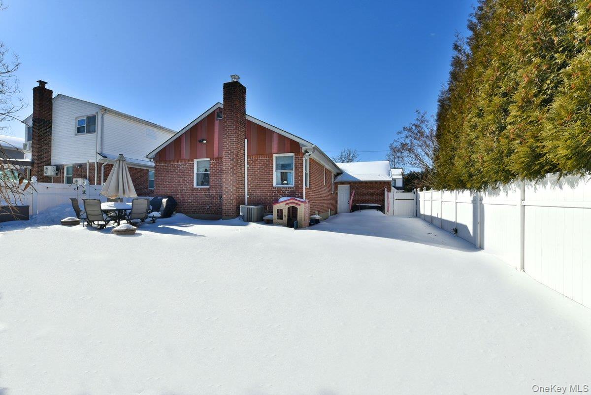 148 Simonson Road Mineola, NY 11501 - Photo 19 of 19 a front view of a house with a yard