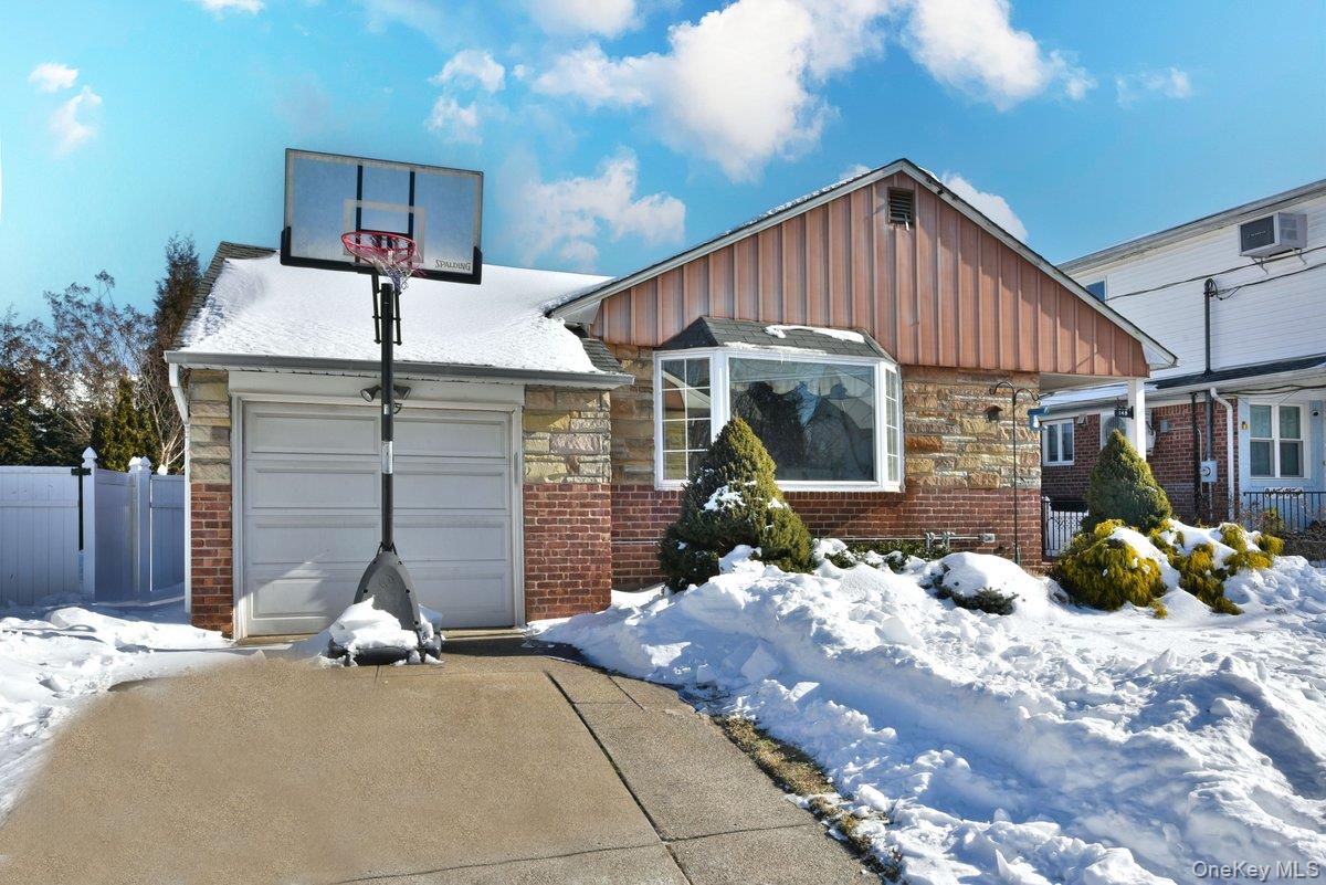 148 Simonson Road Mineola, NY 11501 - Photo 2 of 19 a front view of a house with a yard