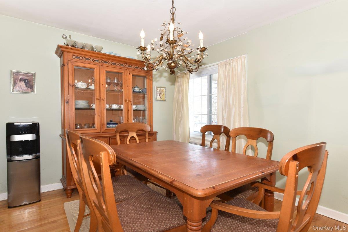 148 Simonson Road Mineola, NY 11501 - Photo 8 of 19 a view of a dining room with furniture and window