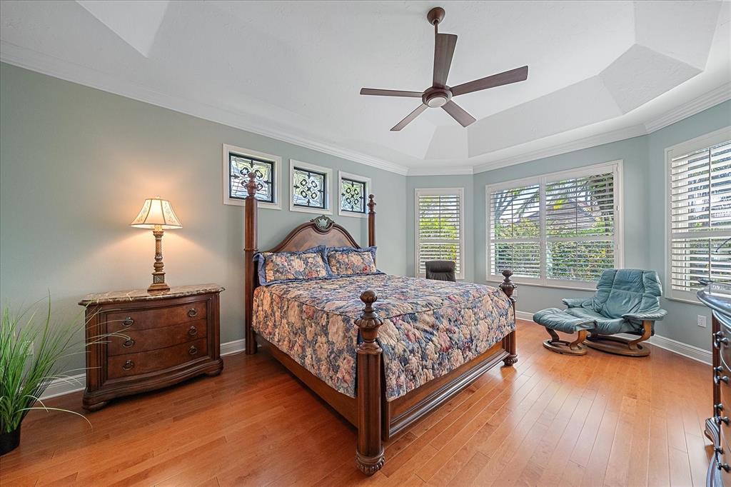 7825 Troon Court Lakewood Ranch, FL 34202 - Photo 22 of 40 a bedroom with a bed and window