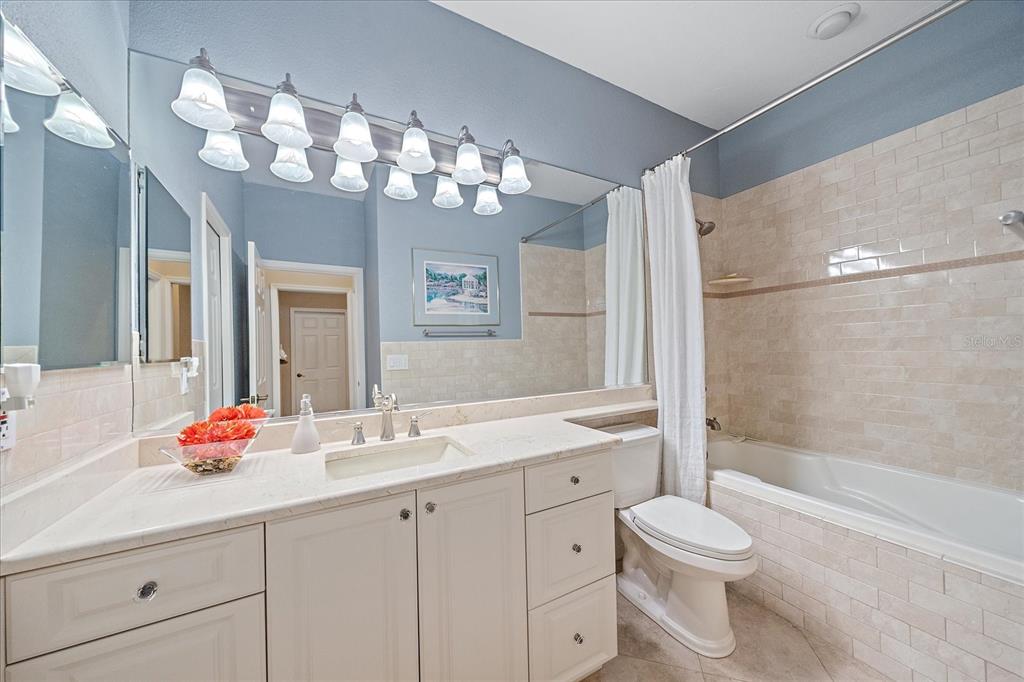 7825 Troon Court Lakewood Ranch, FL 34202 - Photo 30 of 40 a bathroom with a sink a toilet and shower