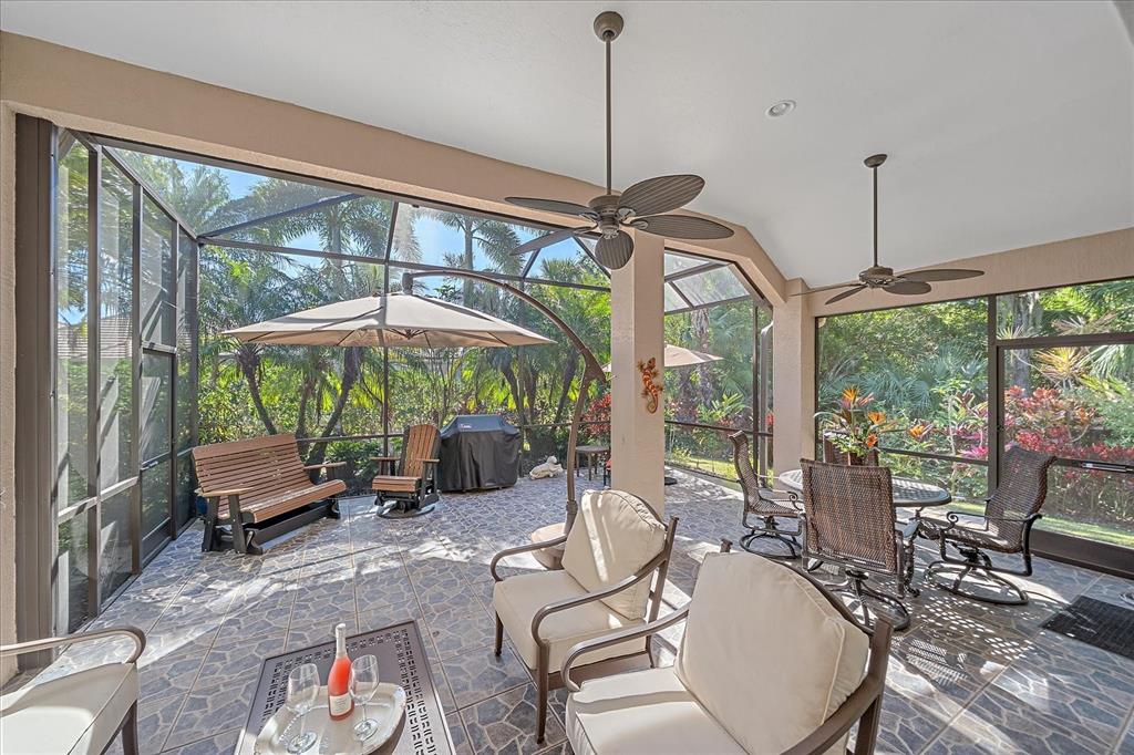 7825 Troon Court Lakewood Ranch, FL 34202 - Photo 35 of 40 a dining room with furniture water windows and wooden floor
