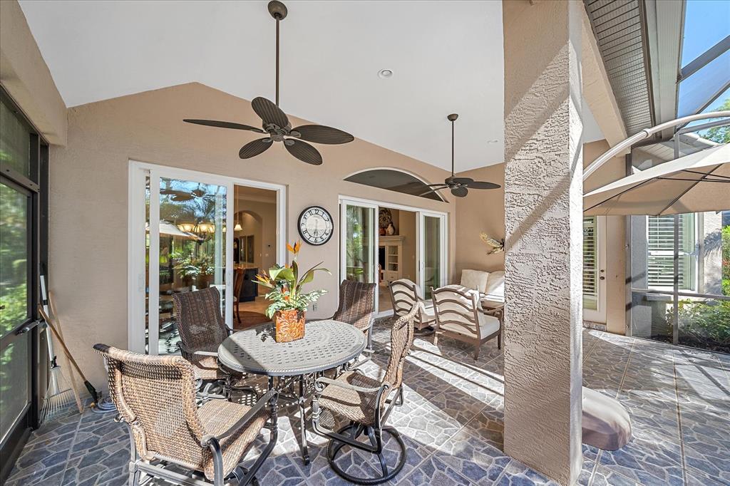 7825 Troon Court Lakewood Ranch, FL 34202 - Photo 38 of 40 a view of a dining room with furniture window and outside view
