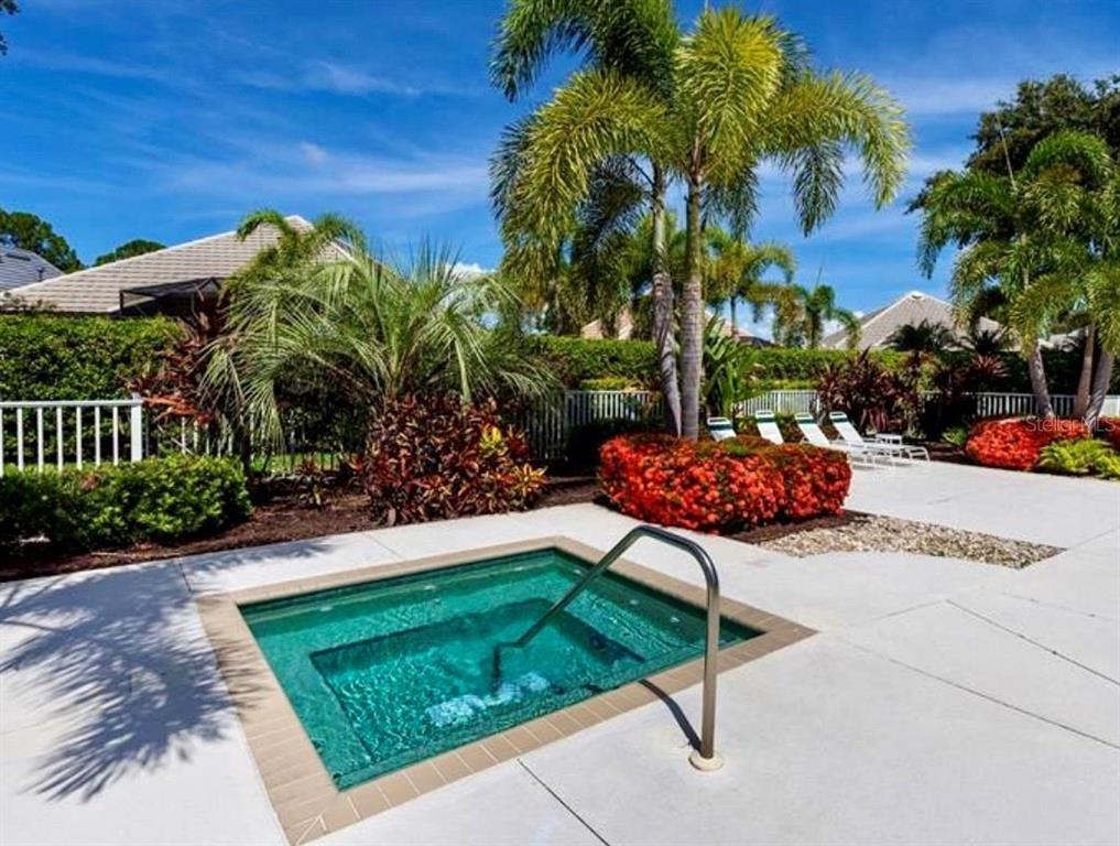 7825 Troon Court Lakewood Ranch, FL 34202 - Photo 40 of 40 a garden with a table and a chair
