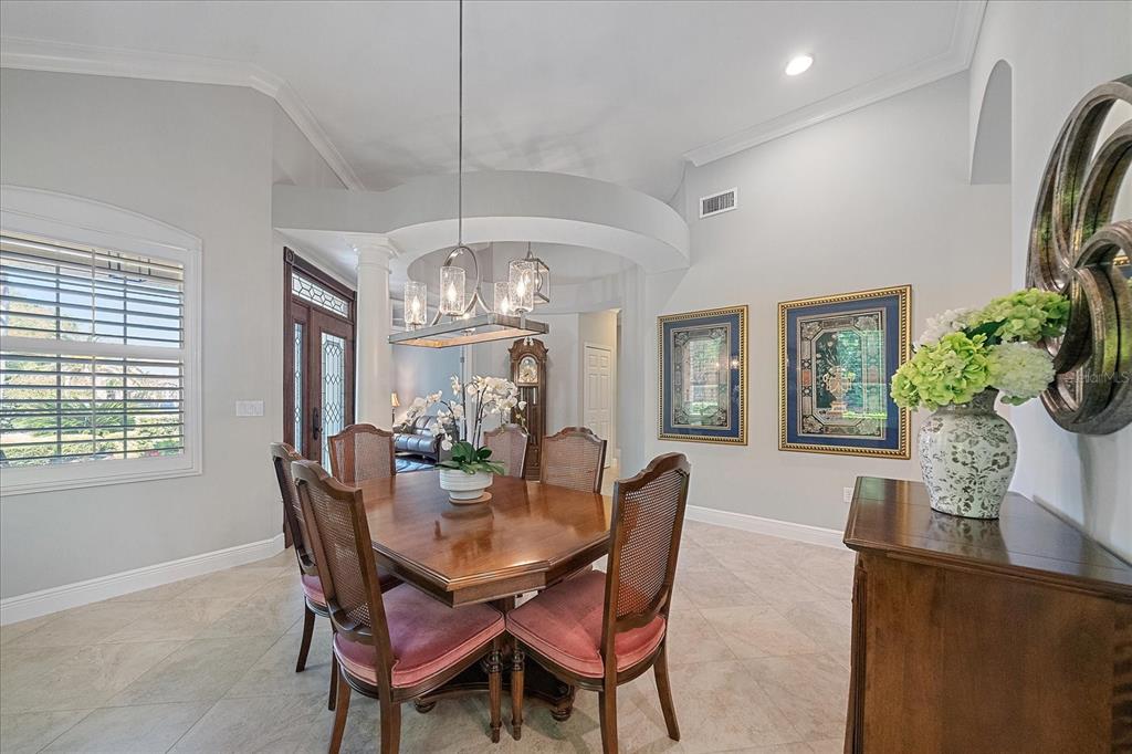 7825 Troon Court Lakewood Ranch, FL 34202 - Photo 5 of 40 a view of a dining room with furniture window and outside view
