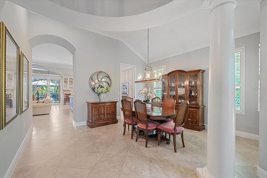 7825 Troon Court Lakewood Ranch, FL 34202 - Photo 6 of 40 a view of a dining room and livingroom with furniture