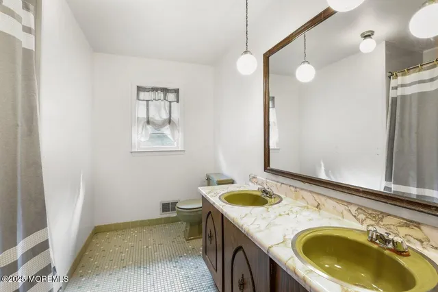 a utility room with a sink a washer and dryer