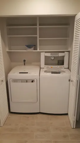 a utility room with washer and dryer