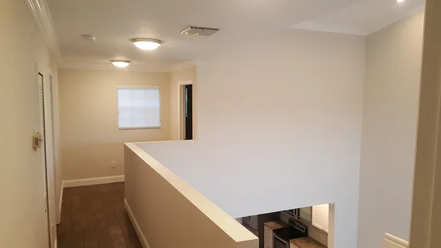 a hallway with washer and dryer