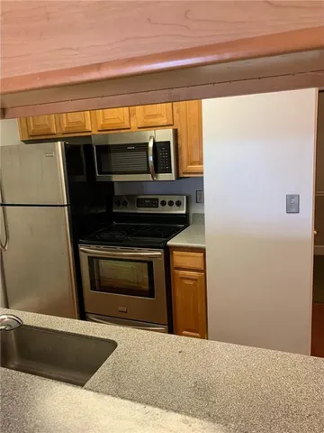 a view of kitchen and microwave