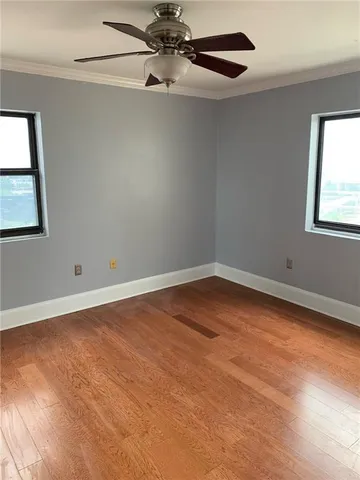 an empty room with a empty space and windows