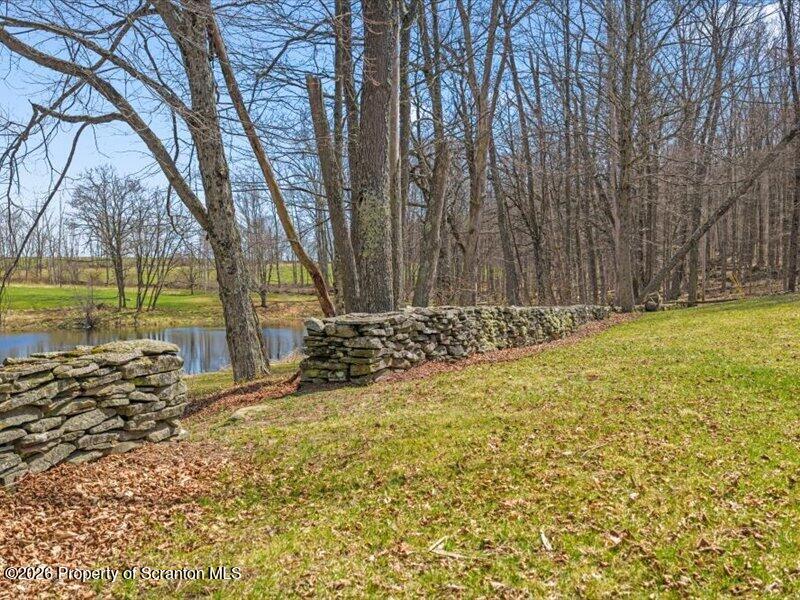 249 Lane Road Kingsley, PA 18826 - Photo 27 of 34 Yrad, pond, stone walls