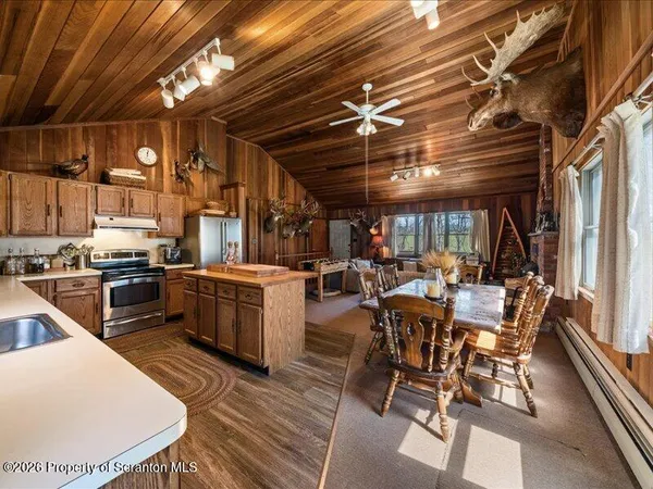 a view of a kitchen with furniture and a kitchen