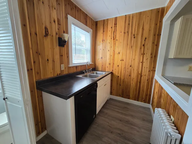 a kitchen with a sink and a refrigerator