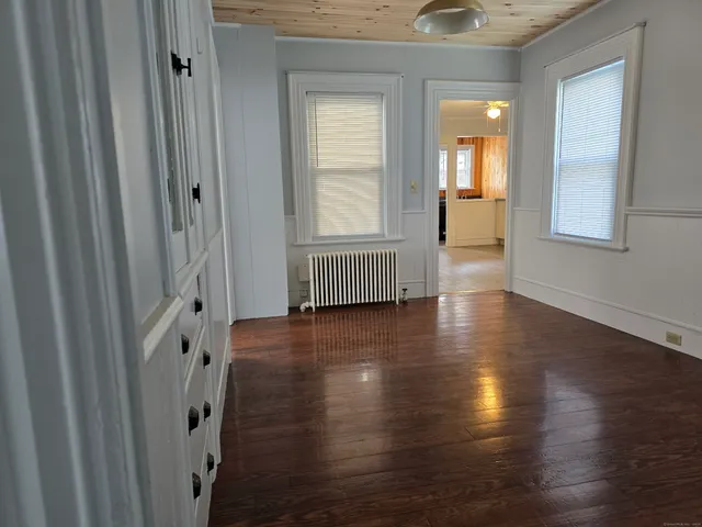 a view of livingroom with furniture and wooden floor