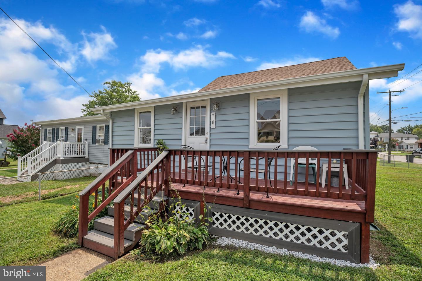 4101 9th Street North Beach, MD 20714 - Photo 1 of 19 a view of a house with a deck