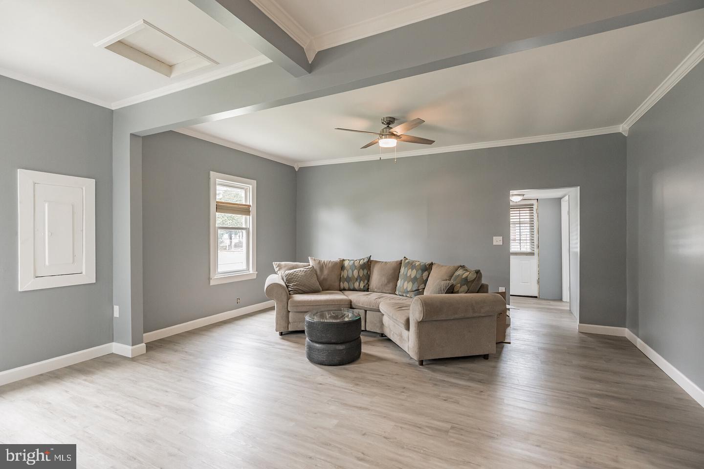 4101 9th Street North Beach, MD 20714 - Photo 12 of 19 a living room with furniture and a wooden floor