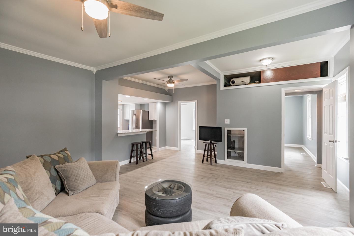 4101 9th Street North Beach, MD 20714 - Photo 14 of 19 a living room with furniture and a fireplace