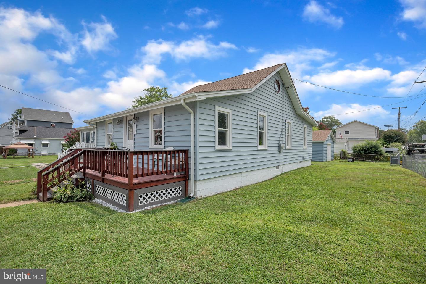 4101 9th Street North Beach, MD 20714 - Photo 2 of 19 a view of a house with a backyard