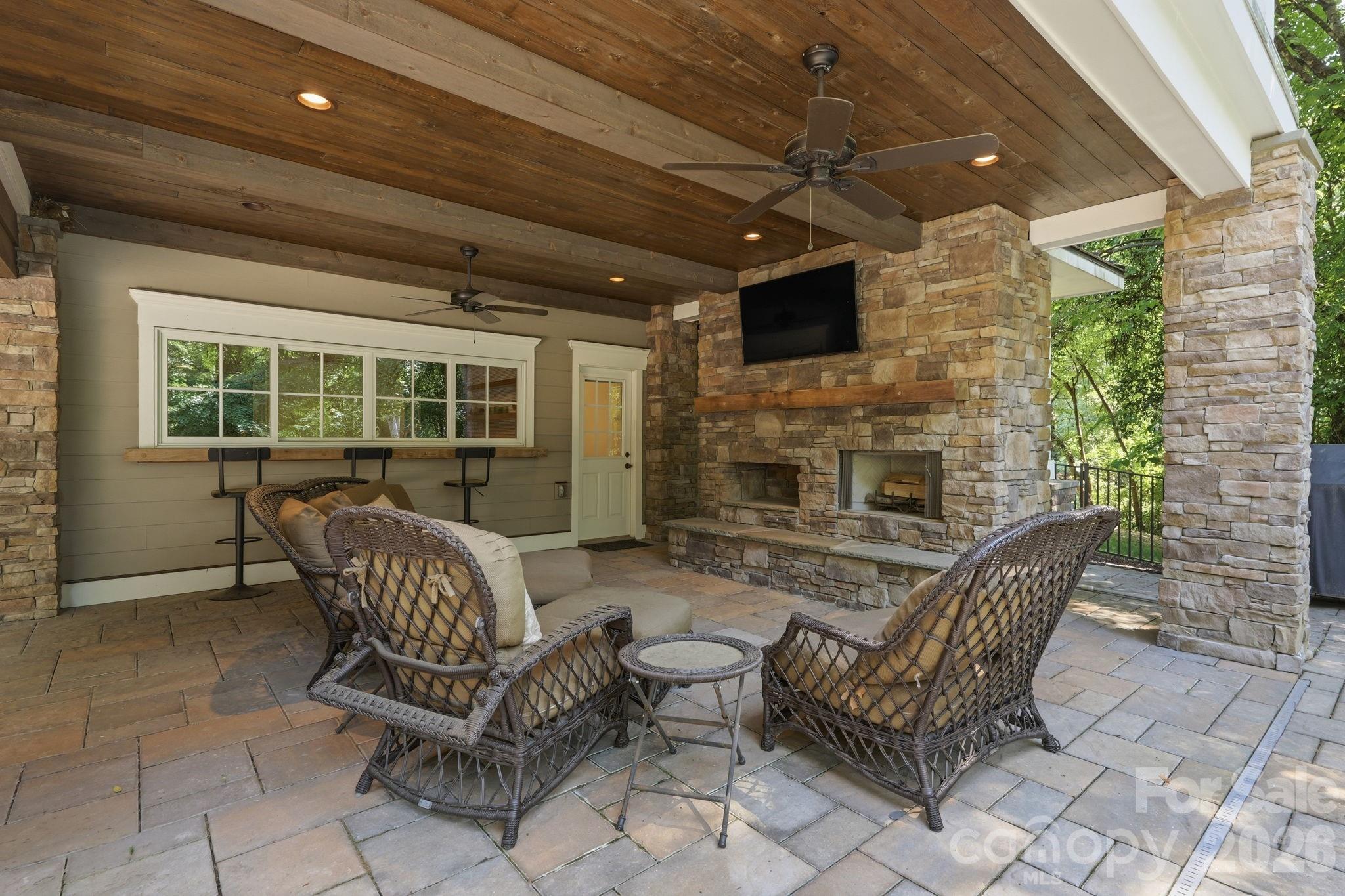 235 Grey Road Davidson, NC 28036 - Photo 34 of 42 a outdoor living space with furniture and a fireplace