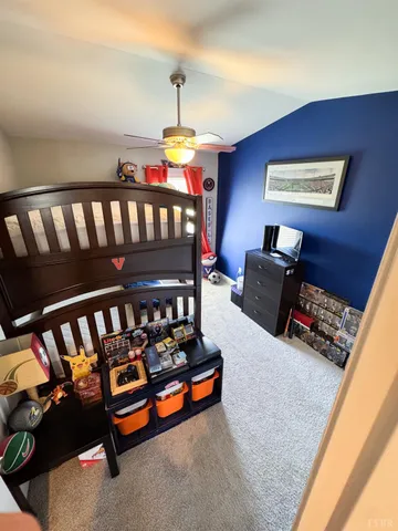 a bedroom with furniture and wooden floor