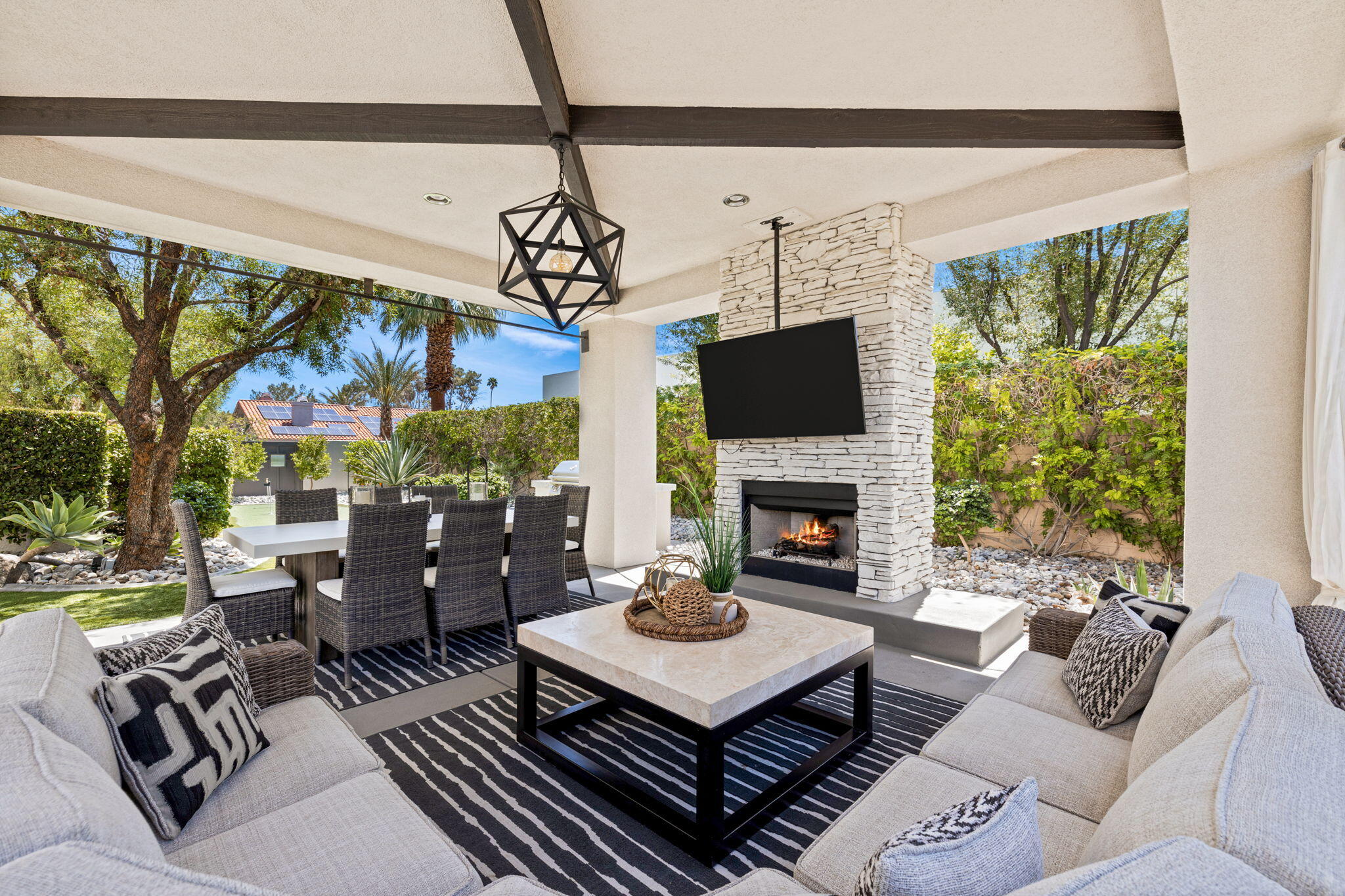 36725 Palm View Road Rancho Mirage, CA 92270 - Photo 120 of 136 a living room with furniture a fireplace and a floor to ceiling window