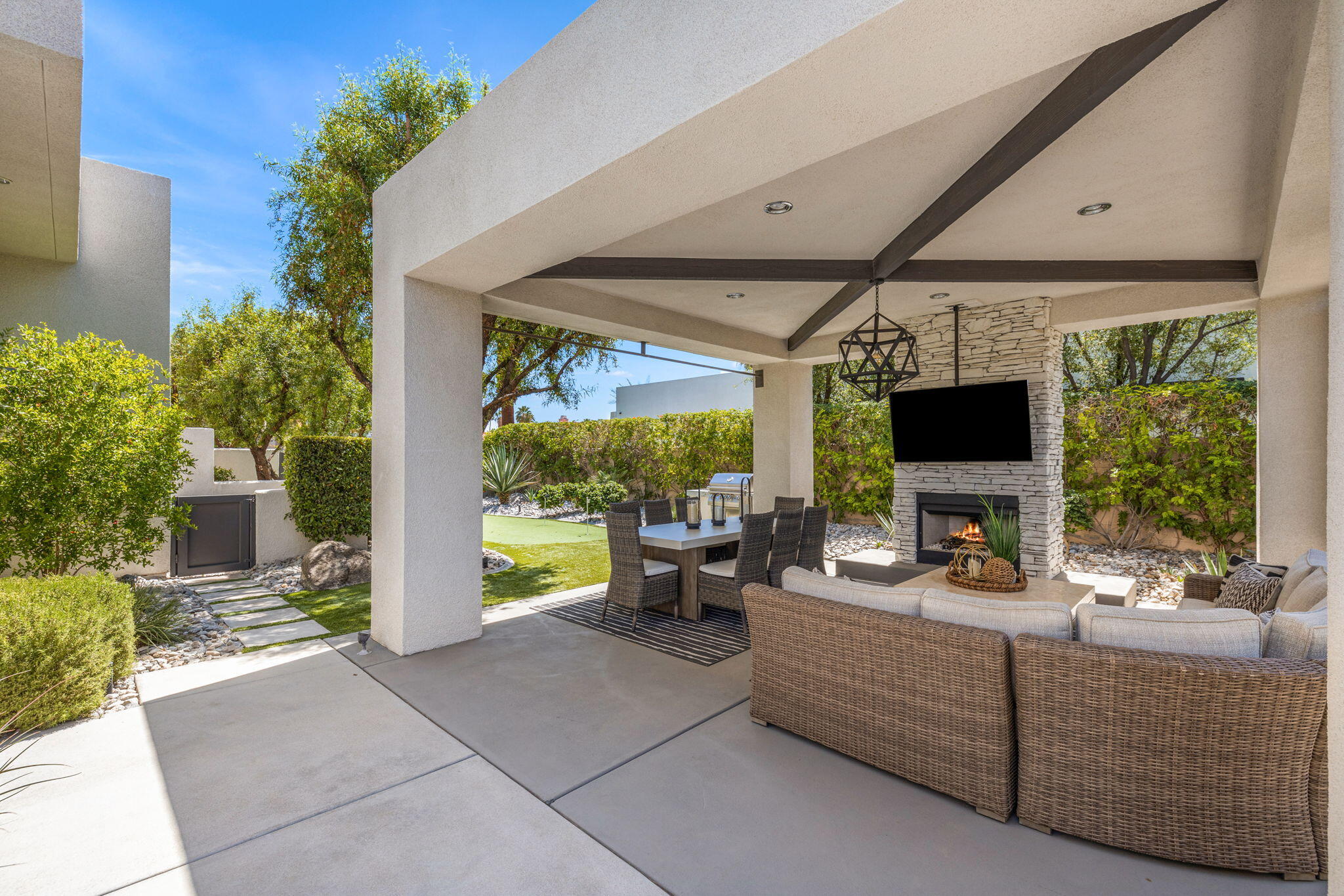 36725 Palm View Road Rancho Mirage, CA 92270 - Photo 121 of 136 a living room with furniture a flat screen tv and a large window