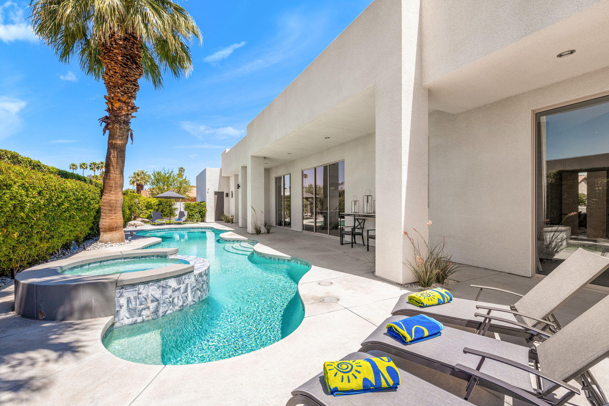 36725 Palm View Road Rancho Mirage, CA 92270 - Photo 122 of 136 a view of a swimming pool with a patio