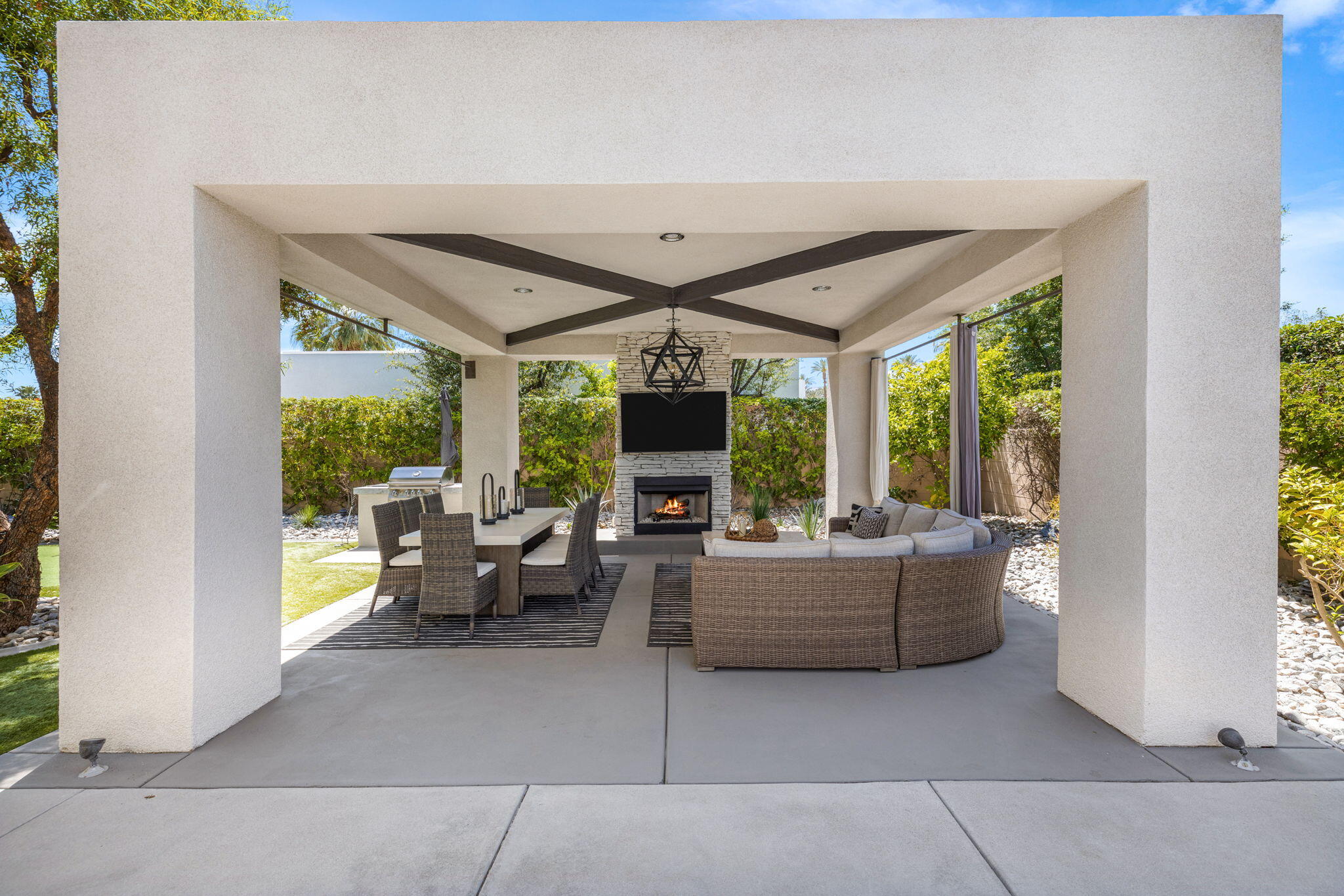 36725 Palm View Road Rancho Mirage, CA 92270 - Photo 123 of 136 a living room with furniture large window and fireplace