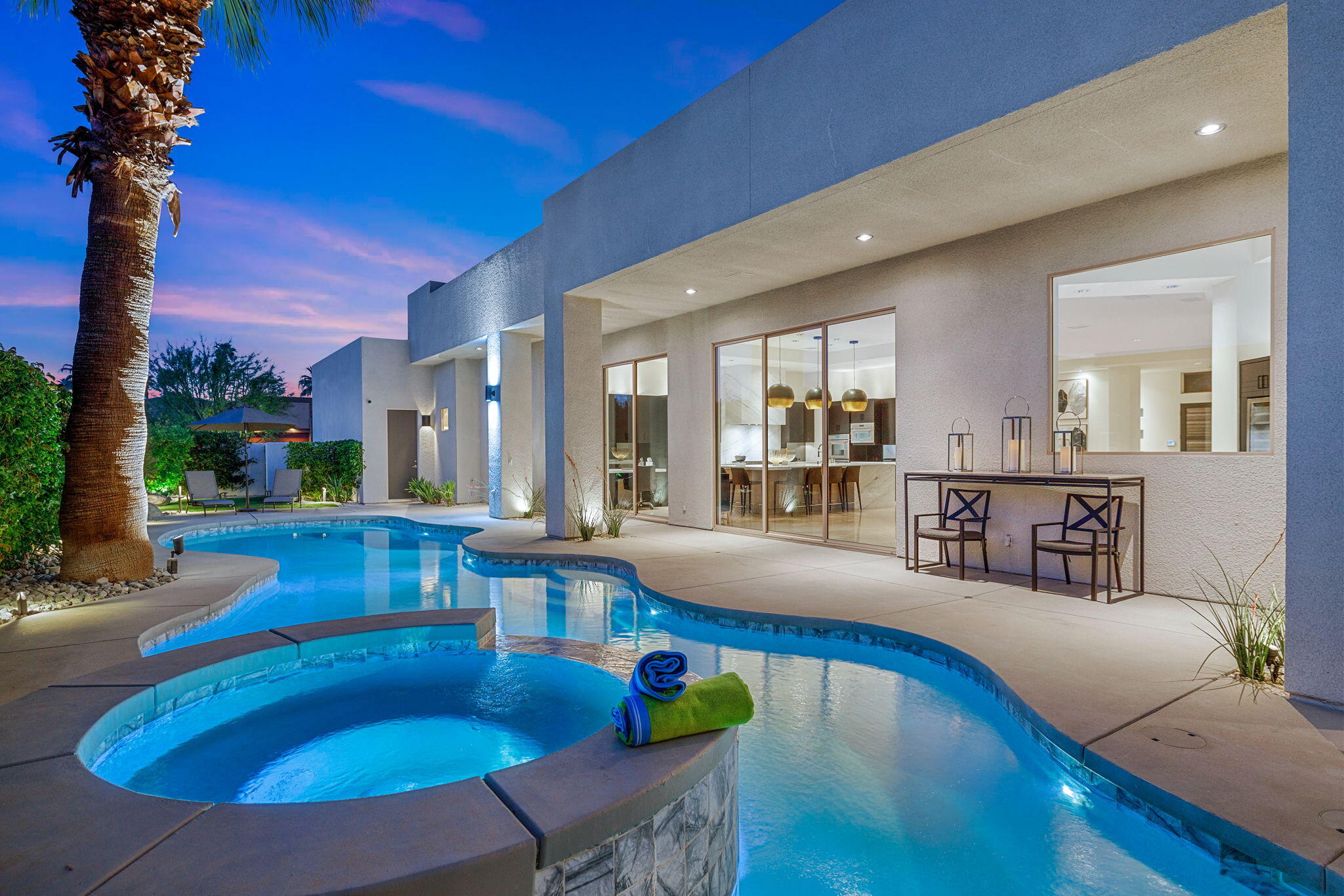 36725 Palm View Road Rancho Mirage, CA 92270 - Photo 24 of 136 a view of a dining room with furniture wooden floor and a fire pit