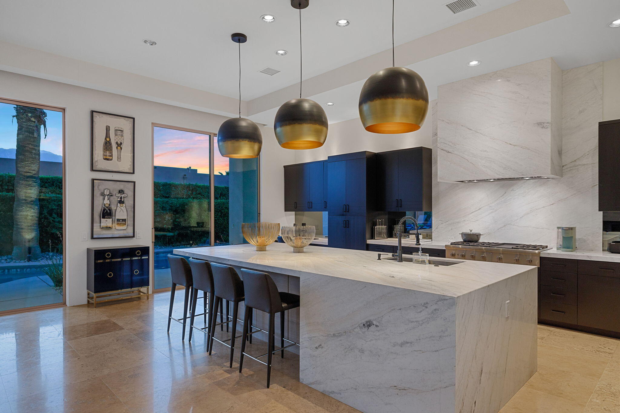 36725 Palm View Road Rancho Mirage, CA 92270 - Photo 30 of 136 a kitchen with stainless steel appliances granite countertop a stove a sink a dining table and chairs with wooden floor