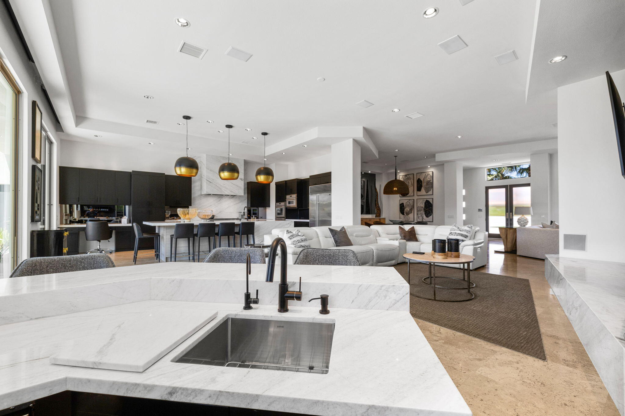 36725 Palm View Road Rancho Mirage, CA 92270 - Photo 36 of 136 a living room with lots of furniture and view of kitchen