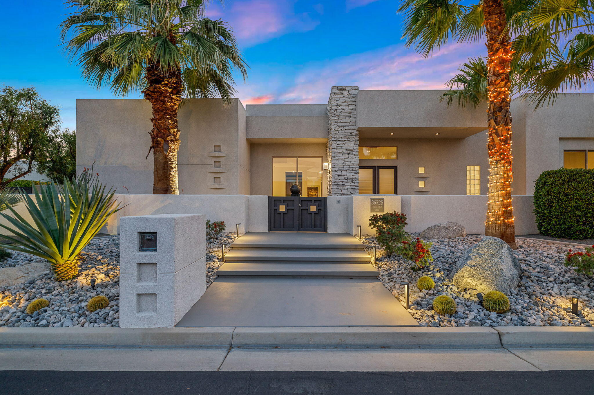 36725 Palm View Road Rancho Mirage, CA 92270 - Photo 4 of 136 a front view of a house with a tree