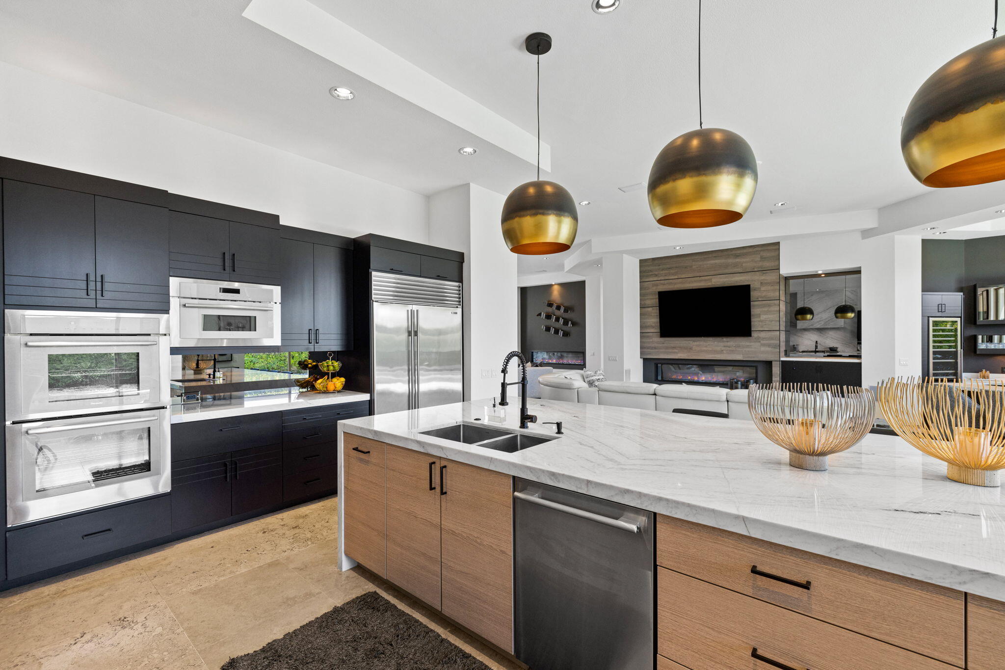 36725 Palm View Road Rancho Mirage, CA 92270 - Photo 45 of 136 a kitchen with a sink and a stove top oven with wooden floor