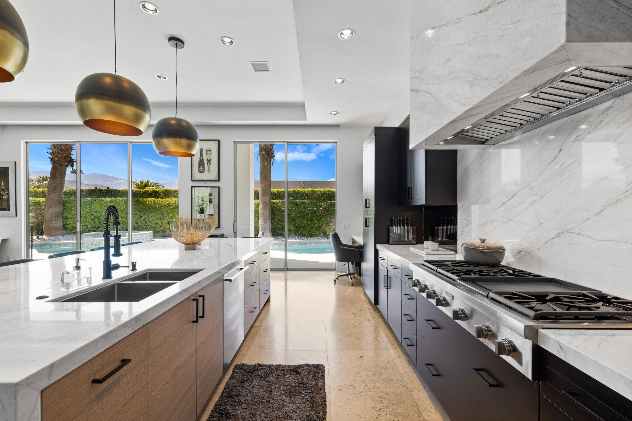 36725 Palm View Road Rancho Mirage, CA 92270 - Photo 53 of 136 a kitchen with stainless steel appliances granite countertop a sink a stove and a wooden floors