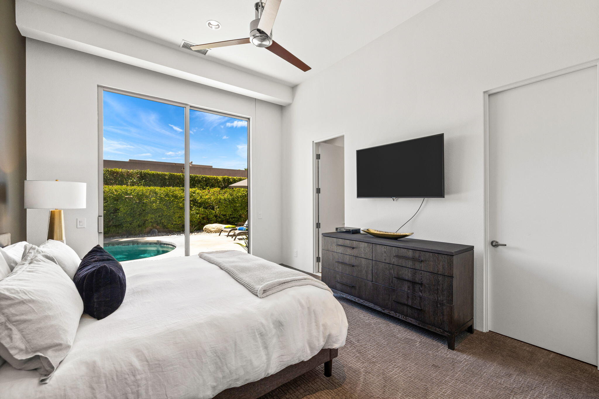 36725 Palm View Road Rancho Mirage, CA 92270 - Photo 81 of 136 a bedroom with a bed and a flat tv screen on dresser