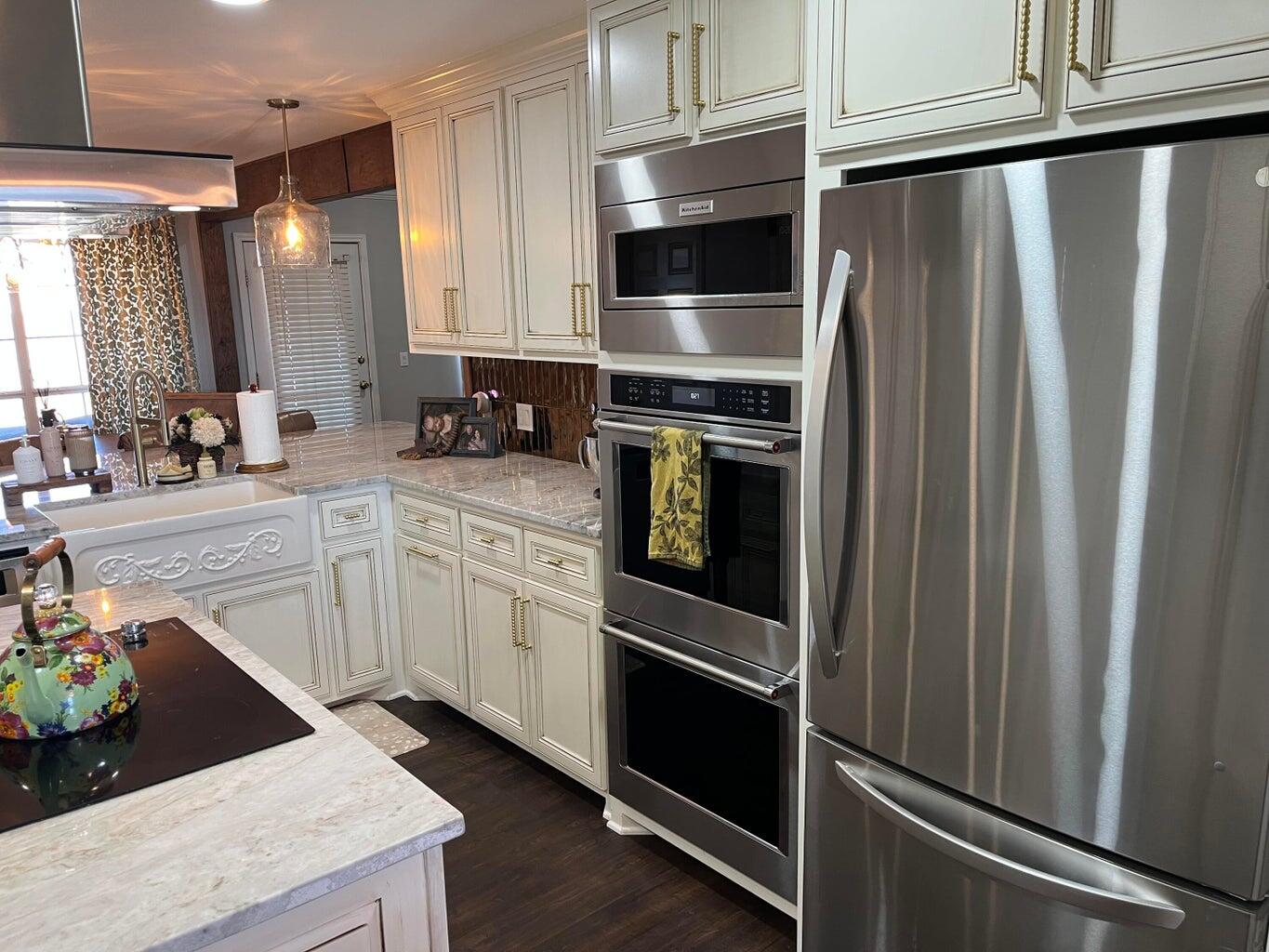 1492 Co Road Hale Center, TX 79041 - Photo 11 of 64 a kitchen with stainless steel appliances a refrigerator sink and microwave