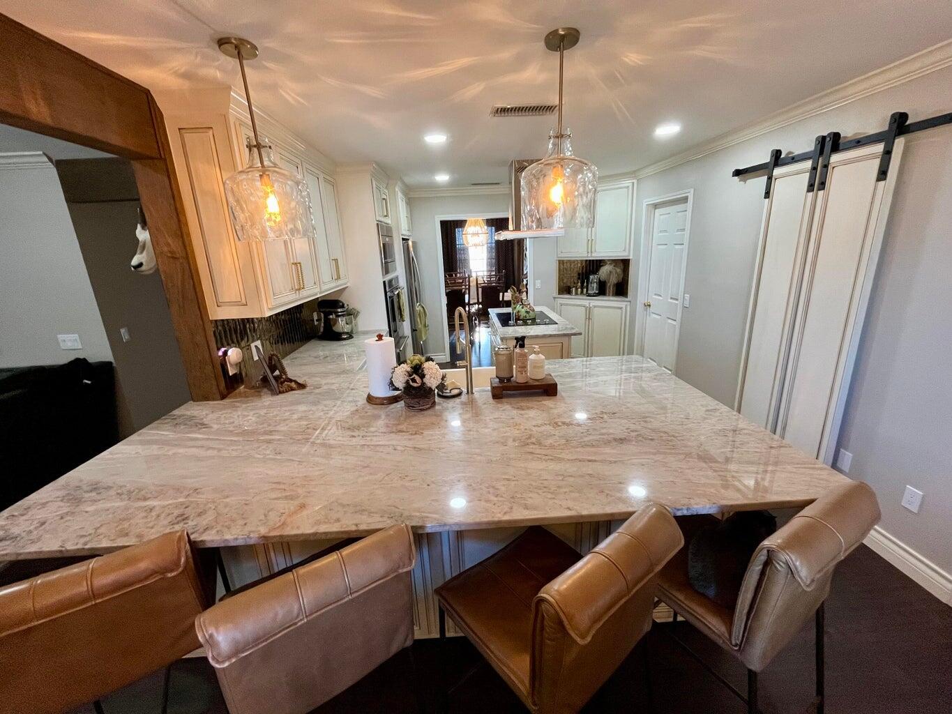 1492 Co Road Hale Center, TX 79041 - Photo 12 of 64 a kitchen with a table chairs refrigerator and microwave