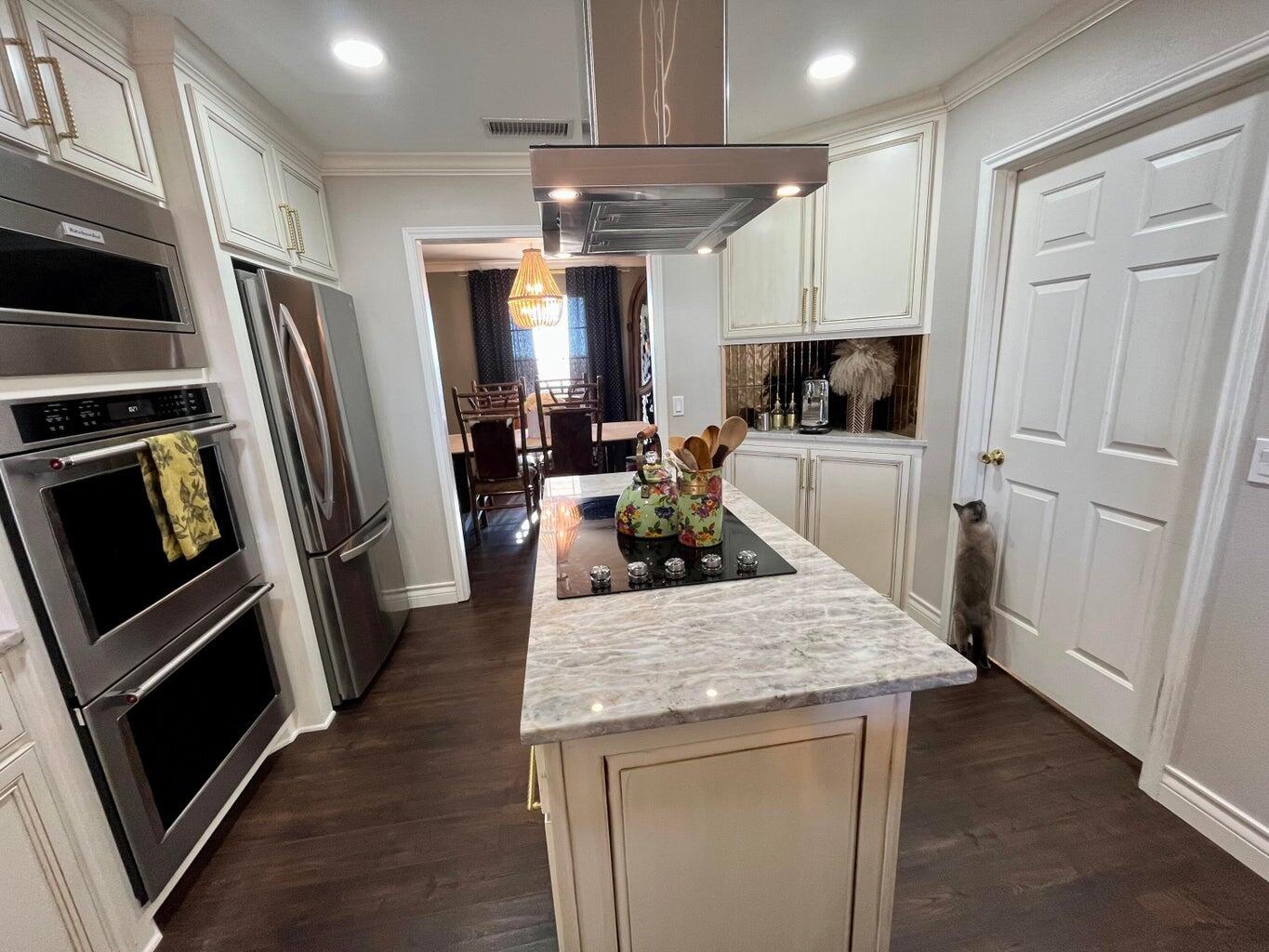1492 Co Road Hale Center, TX 79041 - Photo 13 of 64 a kitchen with a stove a refrigerator and a sink